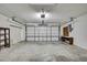 Clean and spacious garage offering ample storage and parking space with an automatic door at 1717 Osprey Ln, Lutz, FL 33549
