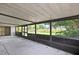 The enclosed lanai offers panoramic views of the lush, green backyard with privacy at 1717 Osprey Ln, Lutz, FL 33549