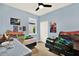 Bright bedroom with light blue walls, two beds, and window providing natural light at 1737 Bonita Bluff Ct, Ruskin, FL 33570