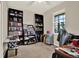 Bedroom featuring dark shelving units, a window, and an organized workspace at 1737 Bonita Bluff Ct, Ruskin, FL 33570