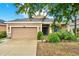 Charming single-story home with a well-manicured lawn and a two-car garage, perfect for suburban living at 1737 Bonita Bluff Ct, Ruskin, FL 33570