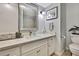 Bright bathroom with white vanity, brushed nickel fixtures, and decorative accents at 17706 Morninghigh Dr, Lutz, FL 33549
