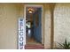 Inviting entryway showcasing a view to the living area featuring hardwood floors and modern lighting at 17706 Morninghigh Dr, Lutz, FL 33549