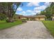 Single story home with a spacious driveway and well-manicured landscaping at 17706 Morninghigh Dr, Lutz, FL 33549