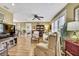 Spacious living room with neutral paint, hardwood floors, comfortable seating, and natural light at 17706 Morninghigh Dr, Lutz, FL 33549