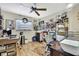 Home office with hardwood floors, a ceiling fan, and lots of storage at 17706 Morninghigh Dr, Lutz, FL 33549