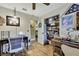 Well-lit office space with hardwood floors, a closet, and two work stations at 17706 Morninghigh Dr, Lutz, FL 33549
