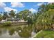Scenic waterfront property with canal views, featuring lush landscaping and inviting outdoor spaces at 17706 Morninghigh Dr, Lutz, FL 33549