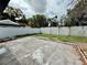 Concrete patio with a white fence in the backyard at 1813 E Wood St, Tampa, FL 33604