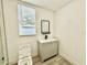 Bathroom features a new vanity, modern fixtures, and a large window at 1813 E Wood St, Tampa, FL 33604