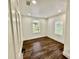 Bright bedroom with hardwood floors, offering natural light and closet space at 1813 E Wood St, Tampa, FL 33604