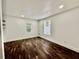 Bright bedroom with hardwood floors and large windows at 1813 E Wood St, Tampa, FL 33604