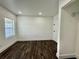 Bedroom with wood floors, white walls, and a closet at 1813 E Wood St, Tampa, FL 33604