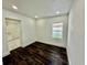 Bedroom with dark hardwood floors and white trim at 1813 E Wood St, Tampa, FL 33604