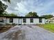 Charming single-story home showcasing its exterior, front lawn, and driveway at 1813 E Wood St, Tampa, FL 33604