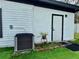 Well-maintained exterior with new AC unit and manicured landscaping at 1813 E Wood St, Tampa, FL 33604