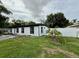 Charming single-story home showcasing its exterior, front lawn, and driveway at 1813 E Wood St, Tampa, FL 33604