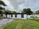 Charming single-story home showcasing its exterior, front lawn, and driveway at 1813 E Wood St, Tampa, FL 33604