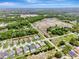 View of neighborhood with many homes, water features, roads, and new construction at 19974 Bluebird Meadow Dr, Lutz, FL 33558