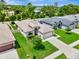 An aerial view of a well-manicured home showcasing its landscaped yard and neighborhood setting at 19974 Bluebird Meadow Dr, Lutz, FL 33558