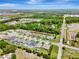 A high-angle view of the neighborhood with houses, ponds, and long roads at 19974 Bluebird Meadow Dr, Lutz, FL 33558