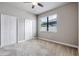 Bedroom with a ceiling fan, neutral paint, carpet and a window at 19974 Bluebird Meadow Dr, Lutz, FL 33558