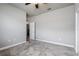 Empty bedroom featuring neutral paint and carpet with entry to a walk-in closet at 19974 Bluebird Meadow Dr, Lutz, FL 33558