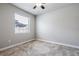 Bright bedroom featuring neutral paint, carpet and a view of the backyard at 19974 Bluebird Meadow Dr, Lutz, FL 33558