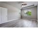 Bright bedroom features wood floors, ceiling fan, and windows that let in ample natural light at 19974 Bluebird Meadow Dr, Lutz, FL 33558