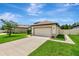 Inviting single-Gathering home with a spacious two-car garage and a meticulously maintained front yard at 19974 Bluebird Meadow Dr, Lutz, FL 33558