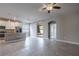 Open living area with modern kitchen featuring stainless appliances and access to an outdoor patio at 19974 Bluebird Meadow Dr, Lutz, FL 33558