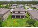 A beautiful backyard features a covered patio and lush green lawn at 21797 Briske Morning Ave, Land O Lakes, FL 34637