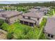 Overhead view of backyard with screened porch and manicured landscaping at 21797 Briske Morning Ave, Land O Lakes, FL 34637