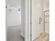 En suite bathroom with a sliding glass door shower, neutral color palette, and modern fixtures at 21797 Briske Morning Ave, Land O Lakes, FL 34637