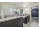 Spacious bathroom features double sink vanity with granite countertop at 21797 Briske Morning Ave, Land O Lakes, FL 34637