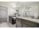 Bright bathroom features double sink vanity with granite countertops at 21797 Briske Morning Ave, Land O Lakes, FL 34637