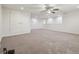 Large bedroom with a ceiling fan, recessed lighting, and gray carpet flooring at 21797 Briske Morning Ave, Land O Lakes, FL 34637