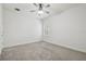 A bright, airy bedroom with neutral carpet, white walls and ceilings, and a window with shutter blinds at 21797 Briske Morning Ave, Land O Lakes, FL 34637
