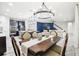 Open-concept dining area with a dining table next to the kitchen and living room at 21797 Briske Morning Ave, Land O Lakes, FL 34637