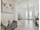 Inviting foyer with wood-look tile, stylish decor, and plenty of natural light at 21797 Briske Morning Ave, Land O Lakes, FL 34637