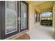 Welcoming front porch with double doors, covered area, and a cozy porch swing at 21797 Briske Morning Ave, Land O Lakes, FL 34637