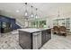 Spacious kitchen island featuring a stainless steel dishwasher and pendant lighting at 21797 Briske Morning Ave, Land O Lakes, FL 34637