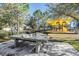 Community playground features ping pong and playground with slides and covered seating at 21797 Briske Morning Ave, Land O Lakes, FL 34637