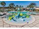 The luxurious community pool area features a splash pad with slide and bucket features at 21797 Briske Morning Ave, Land O Lakes, FL 34637