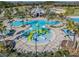 A lively splash pad is surrounded by a tropical pool, enhancing the resort-style experience at 21797 Briske Morning Ave, Land O Lakes, FL 34637