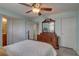 Spacious bedroom featuring natural light, wood flooring, and access to a private bath and closet at 2500 Winding Creek Blvd # G307, Clearwater, FL 33761