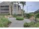 Charming courtyard with benches, greenery, and a central landscaped island for relaxation at 2500 Winding Creek Blvd # G307, Clearwater, FL 33761