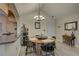 The dining room is well-lit, featuring a round table and wood floors at 2500 Winding Creek Blvd # G307, Clearwater, FL 33761