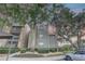Inviting condo building with lush landscaping, mature trees, and a well-maintained exterior at 2500 Winding Creek Blvd # G307, Clearwater, FL 33761