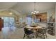 Bright living room and dining area with sliding glass doors opening to a private balcony at 2500 Winding Creek Blvd # G307, Clearwater, FL 33761
